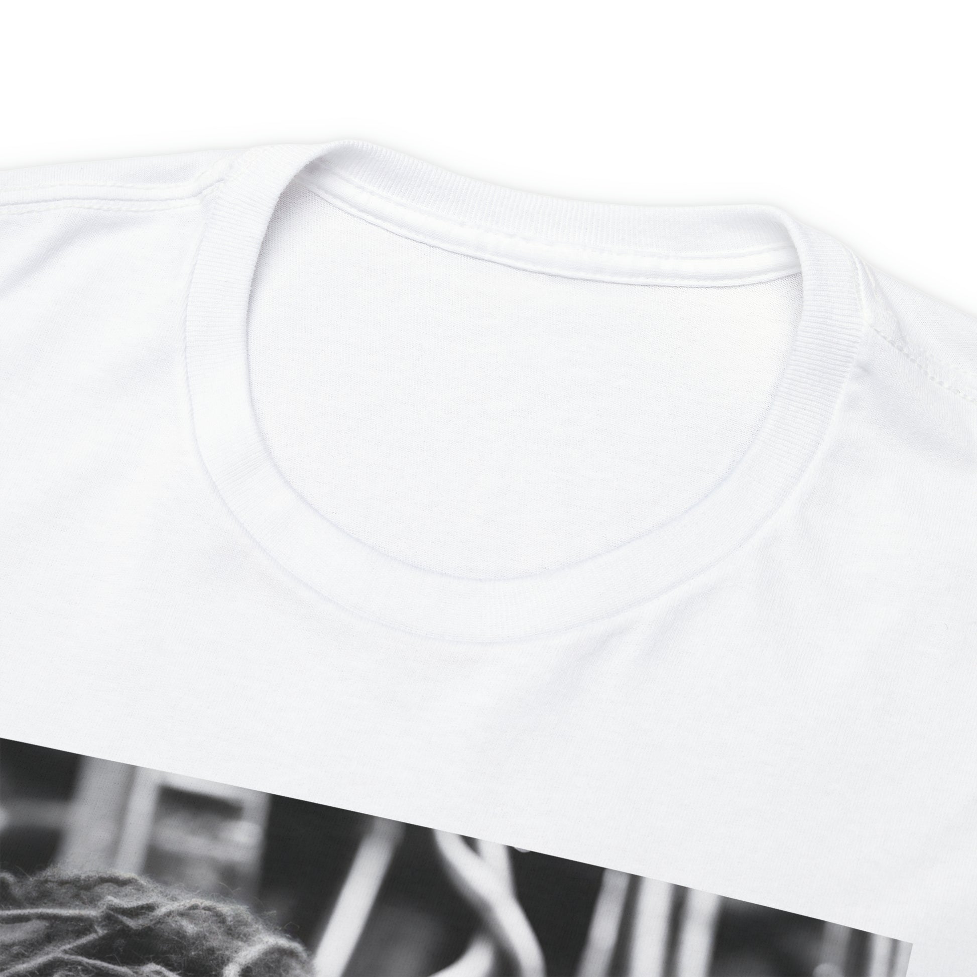 Close-up of the tagless collar of a white t-shirt; the shirt image (not pictured) displays a black and white image of two sapphic cyborgs with foreheads together and eyes closed in a romantic scene.
