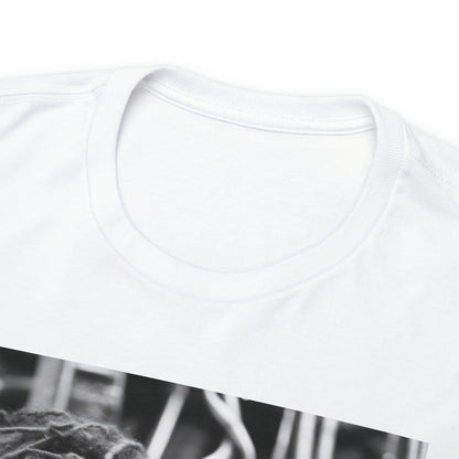 Close-up of the tagless collar of a white t-shirt; the shirt image (not pictured) displays a black and white image of two sapphic cyborgs with foreheads together and eyes closed in a romantic scene.