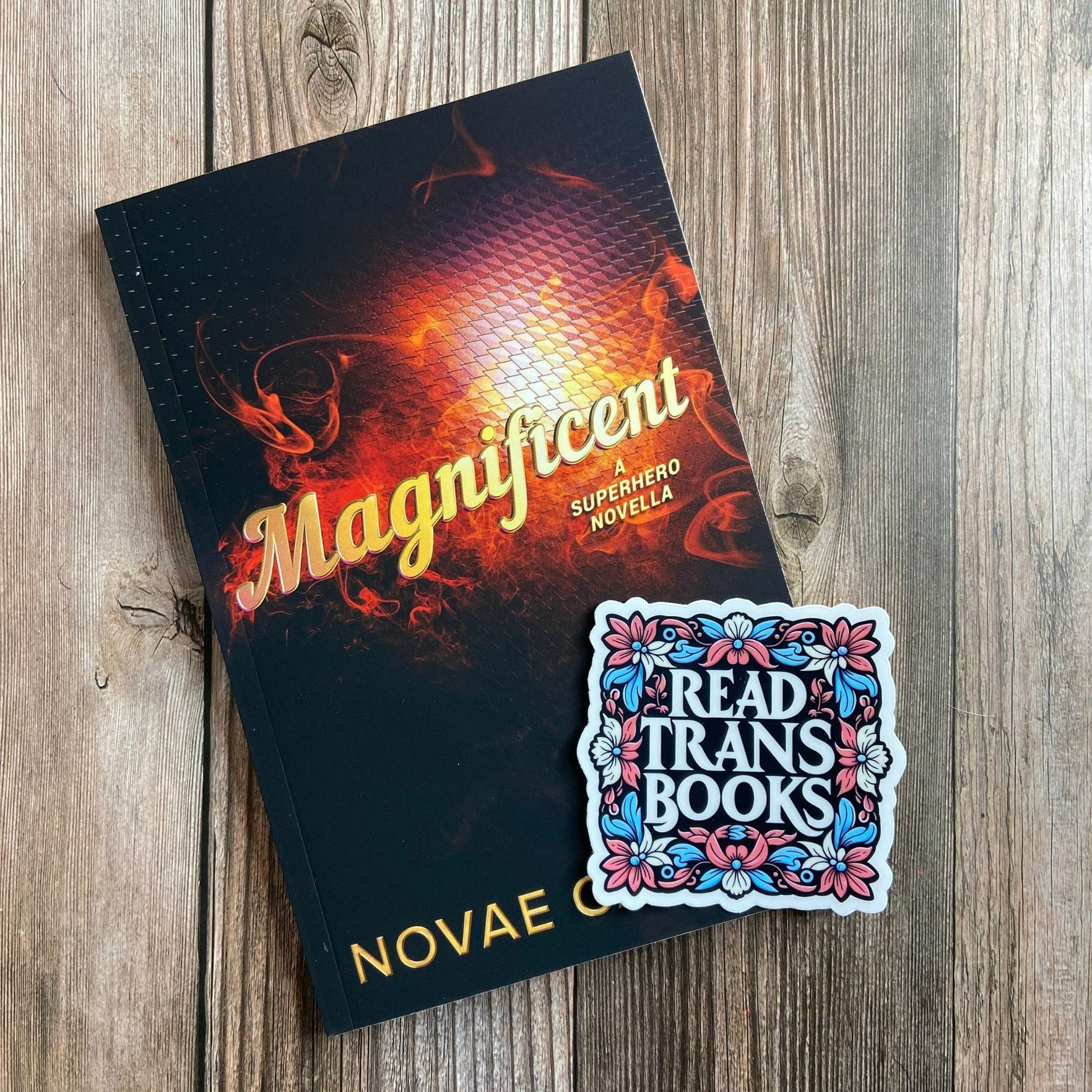 Magnificent: A Superhero Novella (Paperback) and a sticker