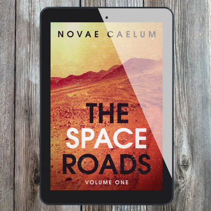 A tablet displaying the cover of the book "The Space Roads - Volume 1" by Novae Caelum, featuring an image of red, rocky landscape and yellow-tinted sky.