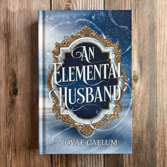 Book cover of "An Elemental Husband: The King's Weaver Book 4" by Novae Caelum, hardcover edition lying flat on a wood surface, showing an ornate silver-and-gold mirror frame over a snowy winter landscape.