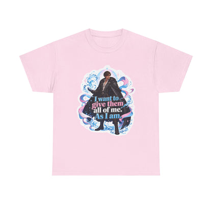 Pink unisex t-shirt with fantasy art of a person with dark curly hair in a long black fur-trimmed coat, surrounded by swirling pink and blue ribbons of magic, and the quote "I want to give them all of me. As I am."