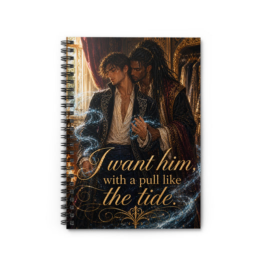 Spiral notebook standing upright, fantasy art of a dreadlocked man in an ornate dark velvet robe embracing a curly-haired man in an open white shirt, swirling blue magic between them, gold quote "I want him, with a pull like the tide."