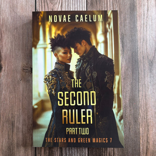 Book cover of "The Second Ruler Part Two: The Stars and Green Magics Book 7" by Novae Caelum, featuring a dark-haired woman with an undercut and a dark-haired man in jeweled black-and-gold coats, foreheads together in a gilded corridor, on wood.